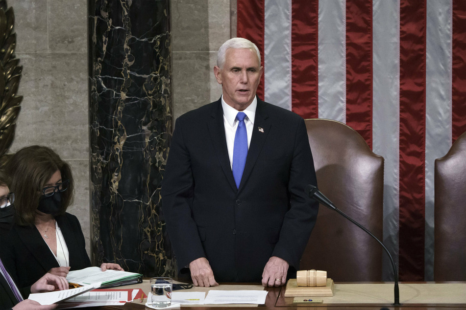 Ex-Vice President Mike Pence reads out Biden's election certification results one day after a violent pro-Trump mob attacked the US Capitol.