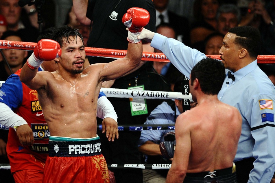 Pacquiao won his first welterweight title with an eighth-round knockout of Oscar De La Hoya in 2008.