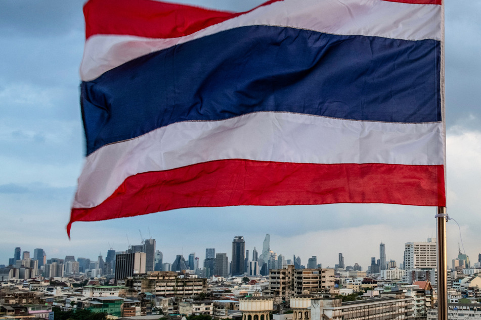 A US academic charged with breaking Thailand's strict royal defamation laws was granted bail on Wednesday but remains in custody.