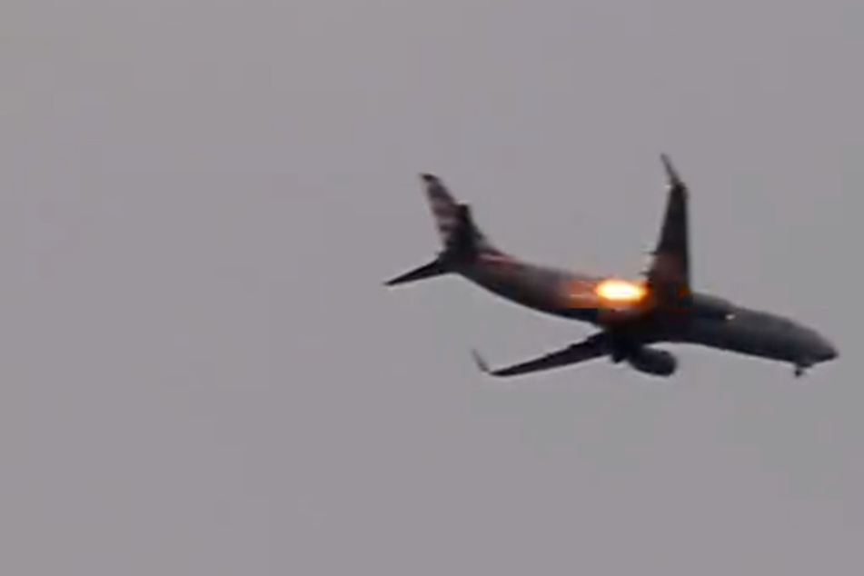A witness on the ground said they filmed the burning engine of the American Airlines flight, and shared the video to Twitter.