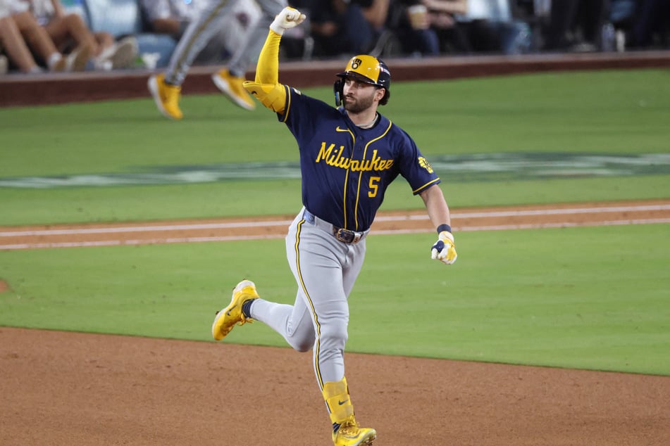 Garrett Mitchell #5 of the Milwaukee Brewers jogs around the bases after hitting a solo home run against the Los Angeles Dodgers on Thursday. The Brewers have punched their ticket to the World Series with a sweep over the Dodgers.