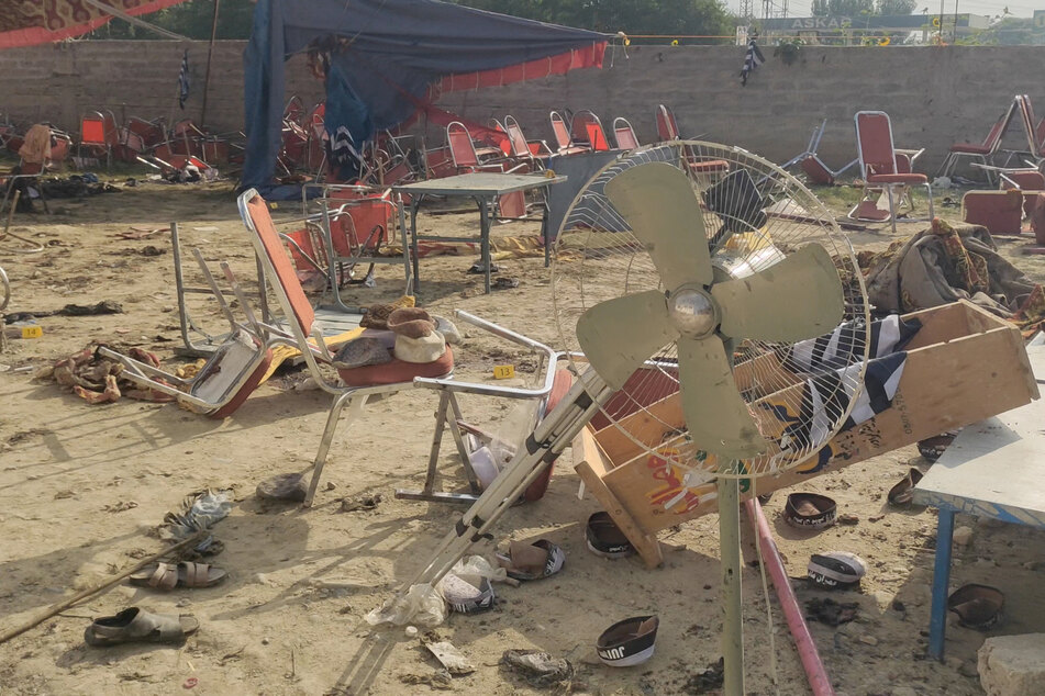 Pakistan reeling after suicide bombing kills dozens at party meeting