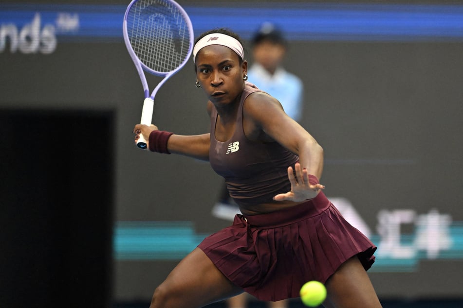 Coco Gauff hits a return during her women's singles match at the China Open on Wednesday. She ultimately lost 6-3, 6-3 to her Belgian opponent.