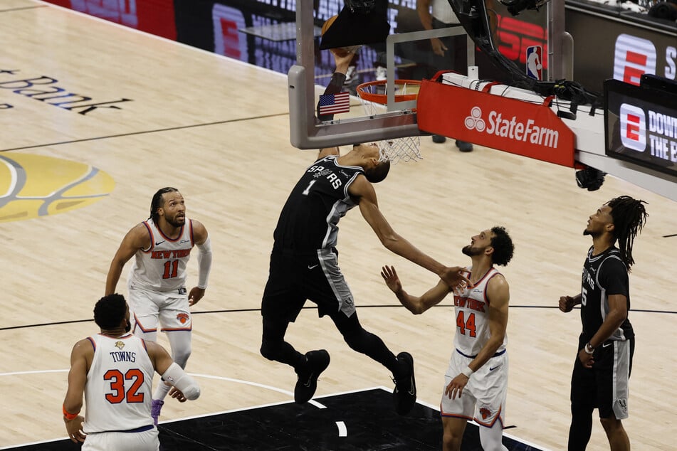 San Antonio Spurs forward Victor Wembanyama shoots the ball against New York Knicks guard Landry Shamet in the second half during game one of the 2026 NBA Finals at Frost Bank Center.