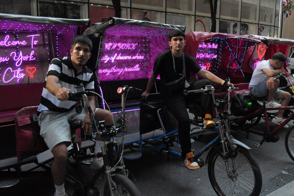 Pedicab drivers are seen in Manhattan on August 15, 2025. New York lawmakers are considering new regulations targeting the controversial tourist vehicles.