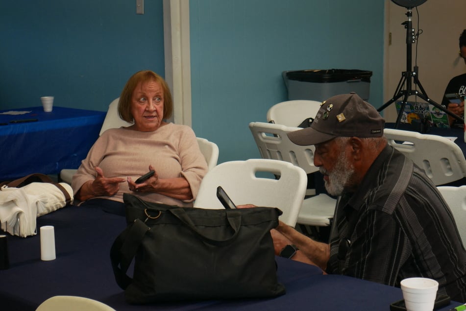 Debbie Wills (l.), Black Lung Program coordinator at Valley Health Systems, and Gary Hairston (r.), president of the National Black Lung Association, attend a meeting of the Kanawha County Black Lung Association in Cabin Creek, West Virginia, on August 13, 2026.