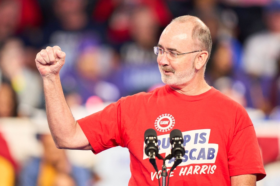 UAW President Shawn Fain speaks to the crowd at a campaign rally for Democratic presidential nominee Kamala Harris in Flint, Michigan, on October 4, 2024.