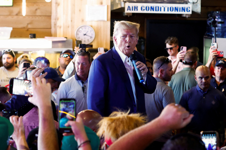 Former president Donald Trump speaks as he campaigns at the Iowa State Fair in Des Moines.