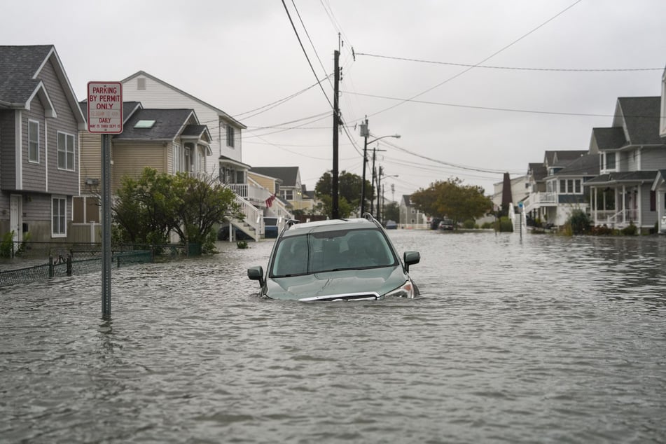 A car appears submerged in water on a flooded road during a Nor'easter storm in Point Pleasant, New Jersey, on September 6, 2026.