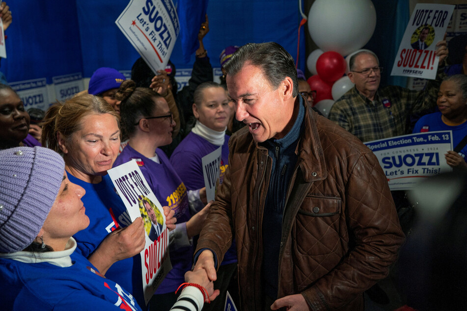 Democrat Tom Suozzi (c.) won a New York special election to replace disgraced former Republican Congressman George Santos.