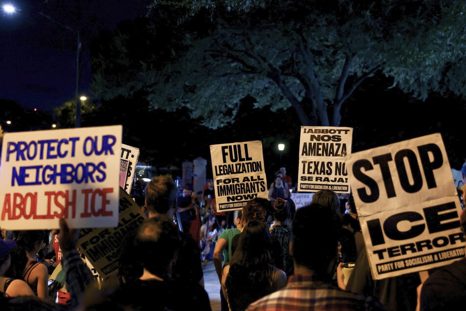 Activists hold an emergency protest a day after the shooting of Wilber Rafael Garces-Perez in Austin, Texas, on September 21. The incident has fueled outrage against President Trump's aggressive immigration agenda.