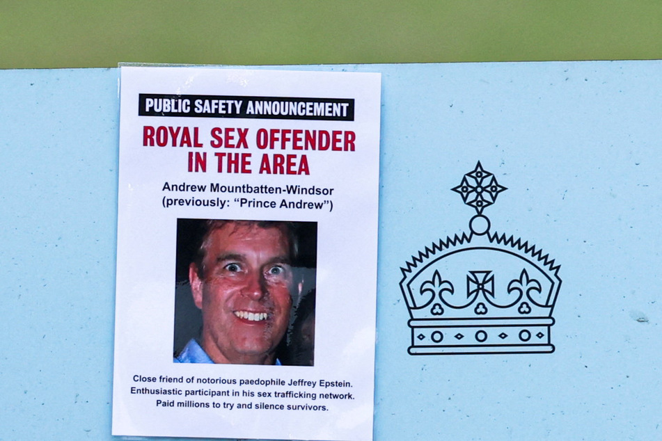 A "Royal Sex Offender in the Area" poster featuring Andrew Mountbatten-Windsor is pictured on a sign leading to the parking area of the Sandringham Estate.