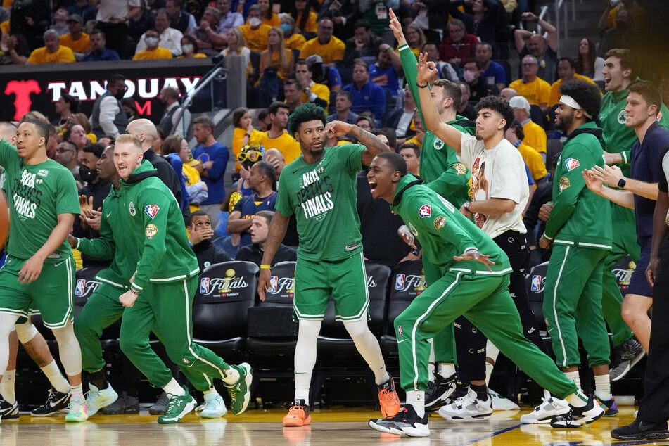 The Boston Celtics celebrate a big road win in Game 1 of the NBA Finals.