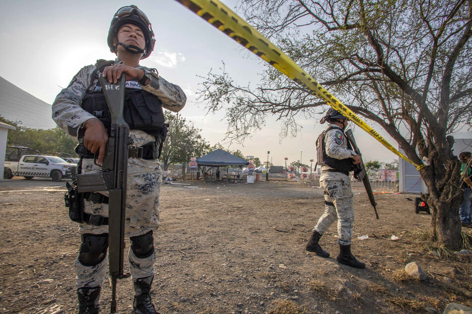 Members of the National Guard guard the area where a stage collapsed the day before during a campaign rally for Mexican presidential candidate Jorge Alvarez Maynez.