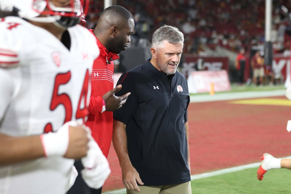 Utah head coach Kyle Whittingham (c) led his team to one of the season's biggest upsets over Oregon.