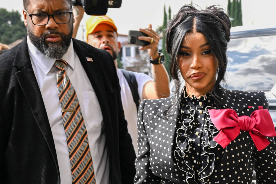 Cardi B throws pen at paparazzi over pregnancy questions: "Stop disrespecting me"