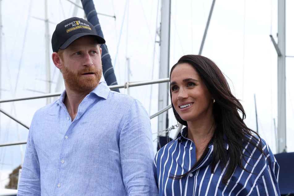 Prince Harry (l.) and Meghan Markle (r.) have returned to the UK, reigniting fierce debate over their security.