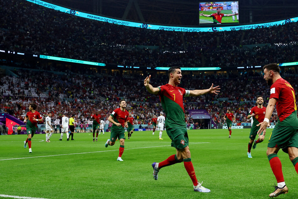 World Cup 2022: Portugal qualifies with Uruguay win as pitch invader flies rainbow flag