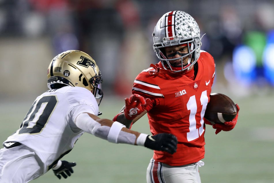 Jaxon Smith-Njigba (r) caught nine passes for 139 yards and a touchdown against Purdue.