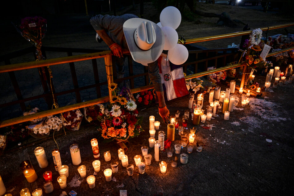 Several dozen people attended an improvised vigil near the nightclub Friday night.