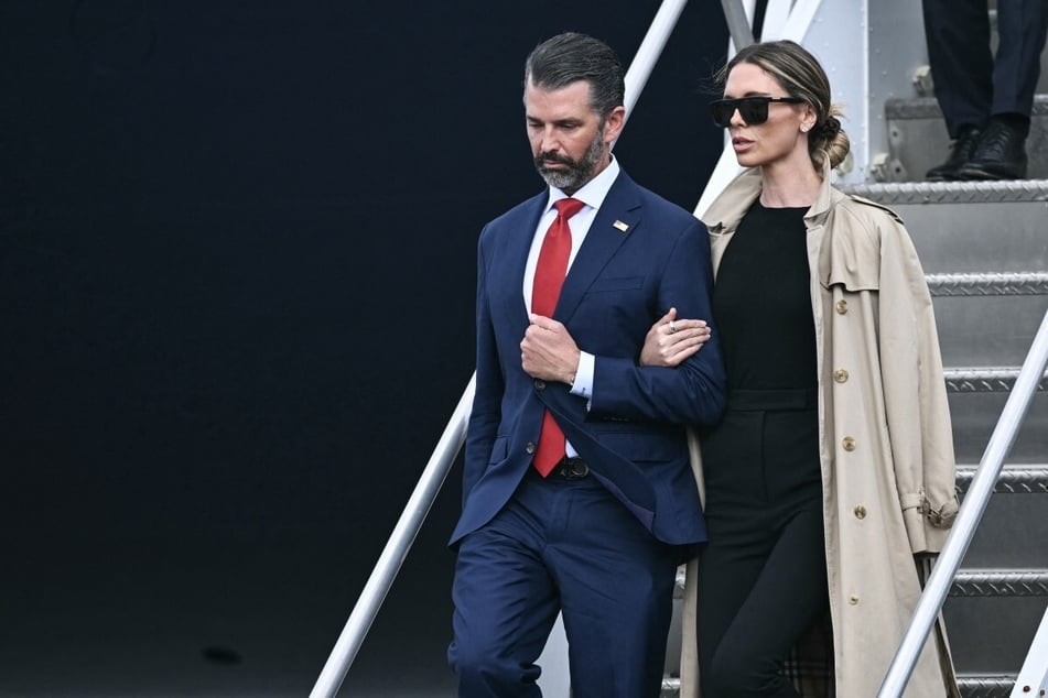 Donald Trump Jr. (l) and his wife Bettina (r) disembark from Air Force One as they arrive at Shannon Airport on September 12, 2026.