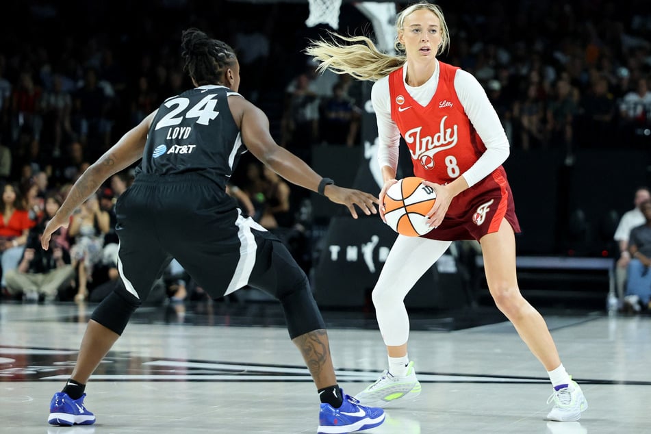 Sophie Cunningham #8 of the Indiana Fever is guarded by Jewell Loyd #24 of the Las Vegas Aces in the third quarter of their game at Michelob ULTRA Arena on July 12, 2026, in Las Vegas, Nevada.