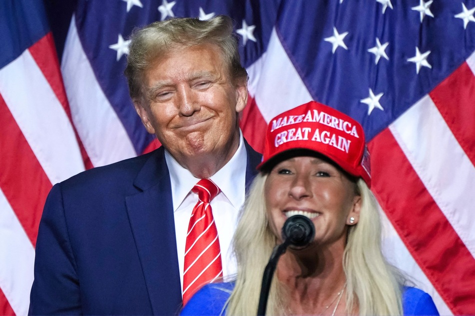 Representative Marjorie Taylor Greene (R) speaking alongside 2024 presidential candidate Donald Trump at a campaign event in Rome, Georgia on March 9, 2024.