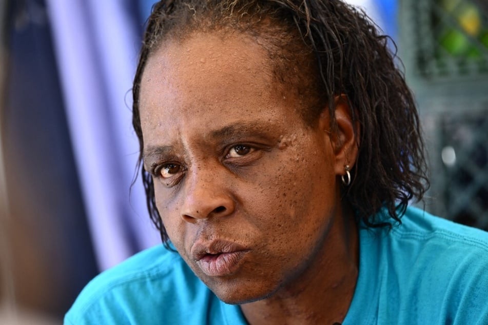 Dana Page, a lifelong Phoenix resident who has experienced heat illness, speaks about life on the streets from a camp in "The Zone."
