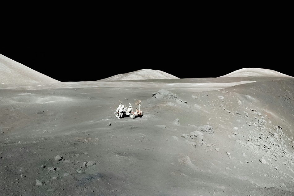 This image was taken by the Apollo 17 astronauts (Dr. H. Jack Schmitt and Gene Cernan). It illustrates a view of the rim of Shorty crater and the lunar roving vehicle against a backdrop of the mountain-like massifs that define the Taurus-Littrow valley.