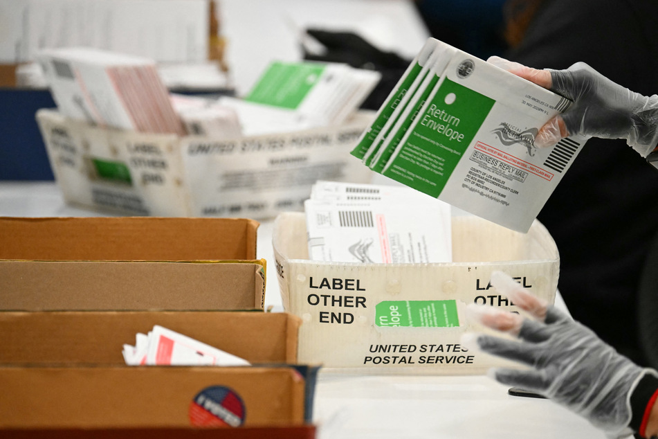 Election workers process mail-in ballots at the Los Angeles County Ballot Processing Center during California's state primary election in the City of Industry on June 2, 2026.