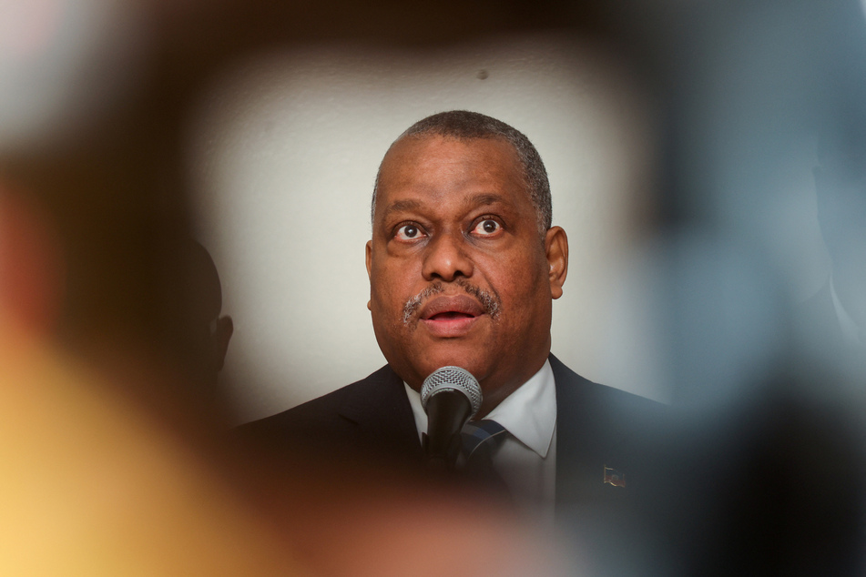 Haitian Prime Minister Garry Conille was unscathed Monday after gangs opened fire near a hospital he was visiting.