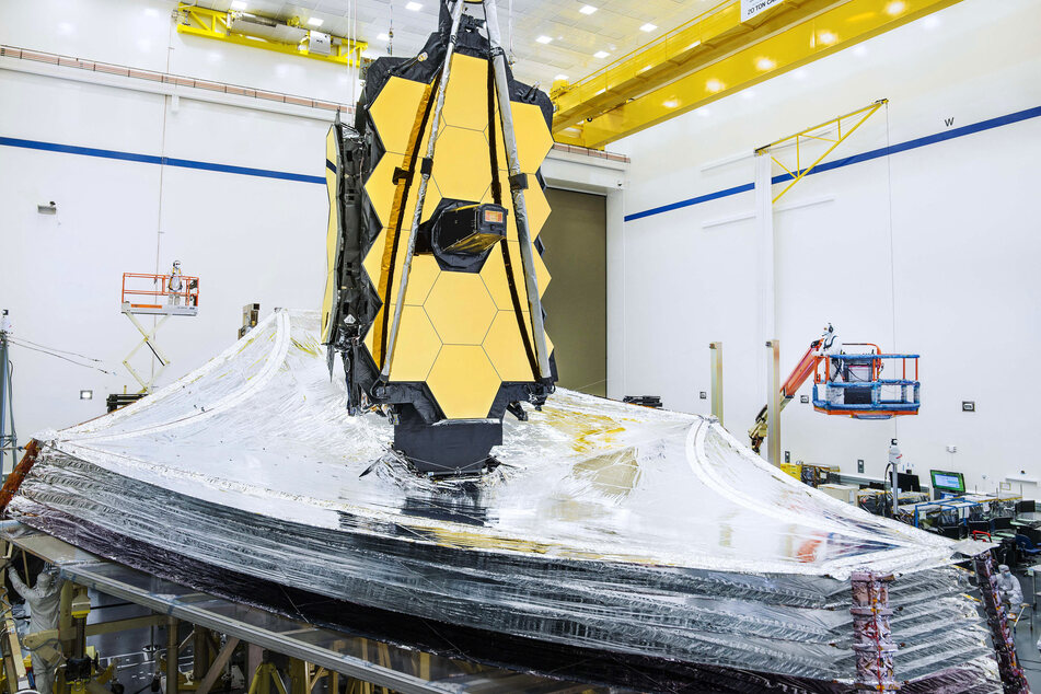 This undated image released by NASA shows the James Webb Telescope being readied for launch.