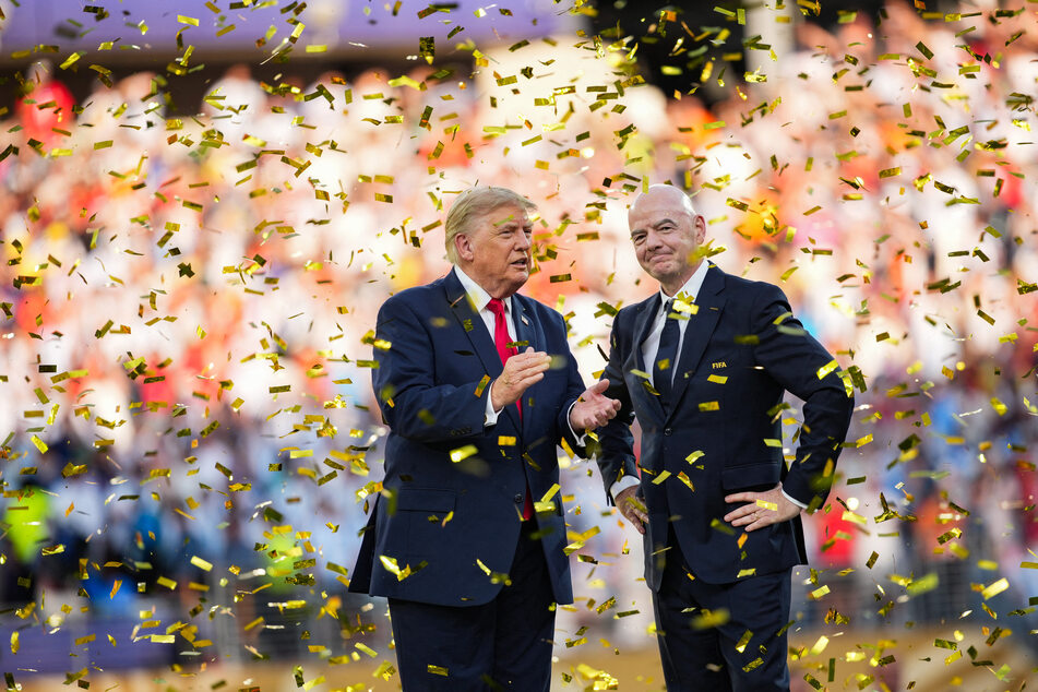FIFA President Gianni Infantino (r) stands with President Donald Trump (l) as Spain celebrates winning the 2026 World Cup final.