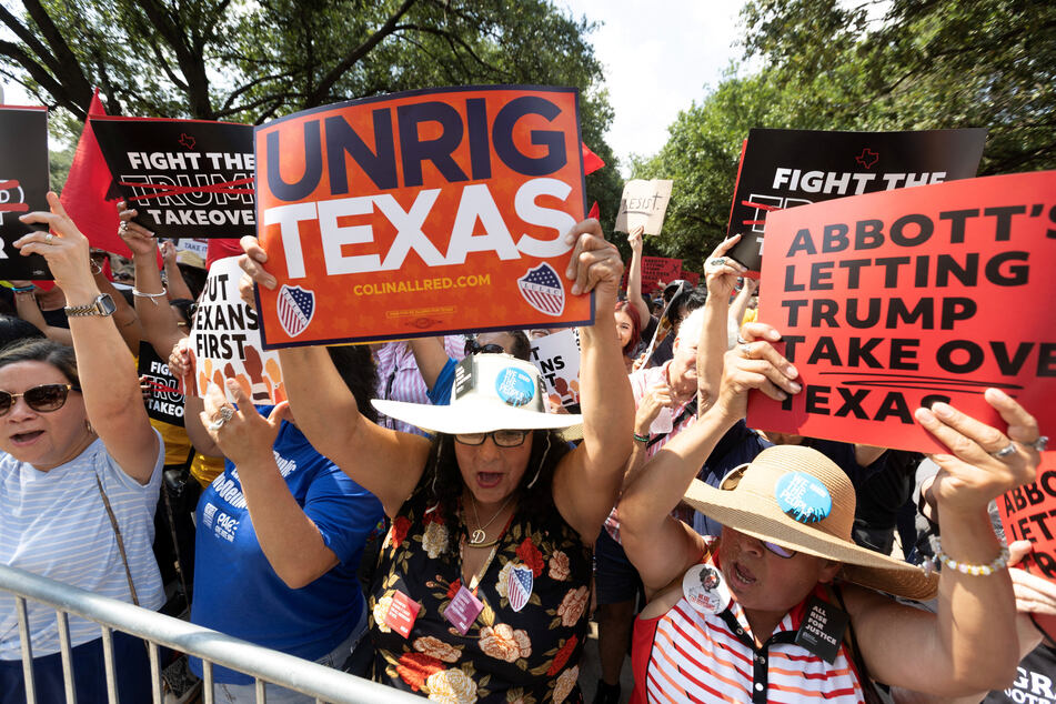 Protesters raise their voices during a "Fight the Trump Takeover" rally against Republican gerrymandering outside the State Capitol in Austin, Texas, on August 16, 2025.