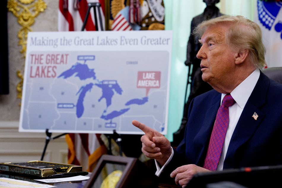 A map labeling Lake Ontario as "Lake America" is displayed as Donald Trump speaks during an event in the White House on Thursday.