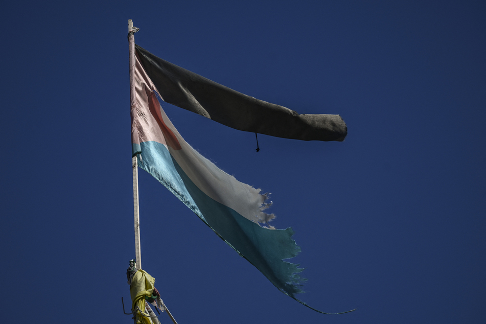A ripped Palestinian flag at the Jenin camp in the West Bank as violence surges in the occupied territory, amid ongoing battles between Israel and the Palestinian group Hamas.