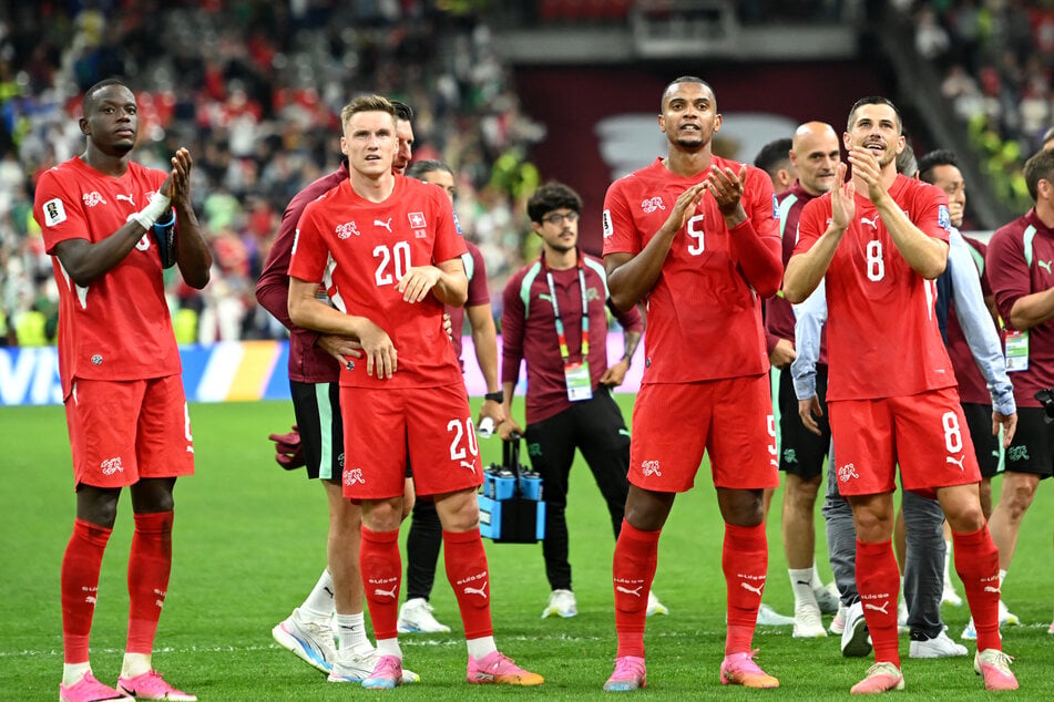 Switzerland's Denis Zakaria, Michel Aebischer, Manuel Akanji, and Remo Freuler celebrate after the match against Algeria on July 2, 2026.