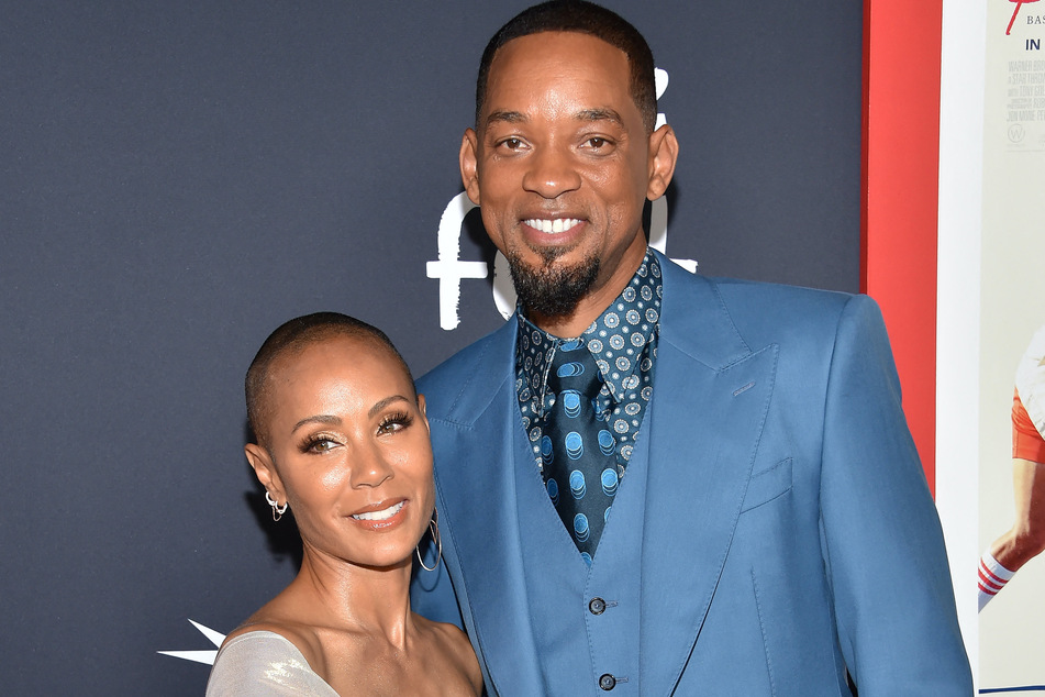 Will Smith spent Christmas with his wife Jada Pinkett-Smith (l) and their family while rocking ugly holiday sweaters.