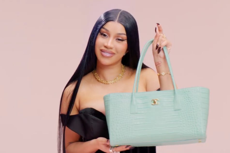 Cardi B revealed what's in her Chanel purse while also vowing to remain pregnant-free this summer.