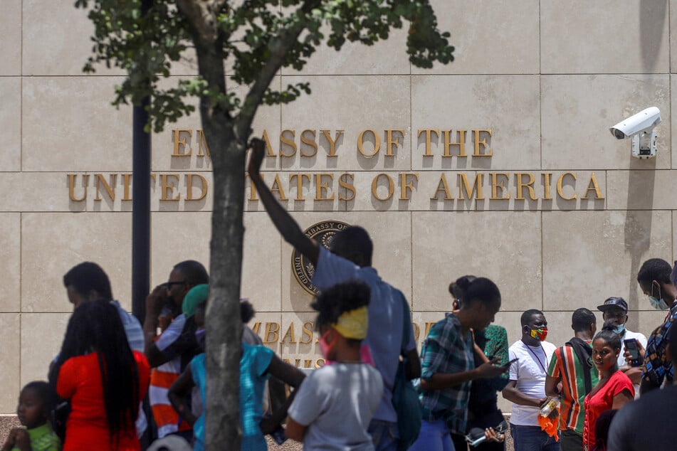 Haitians gather outside the US Embassy after the assassination of President Jovenel Moïse, in Port-au-Prince, Haiti.