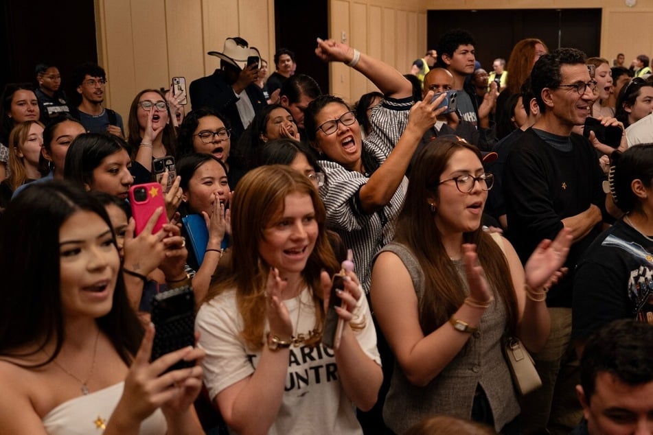 People are seen cheering on Texas Democratic Senate candidate James Talarico at a rally in Houston, Texas, on October 21, 2026. Data shows that outside groups have spent $202 million in support of Paxton in Texas.