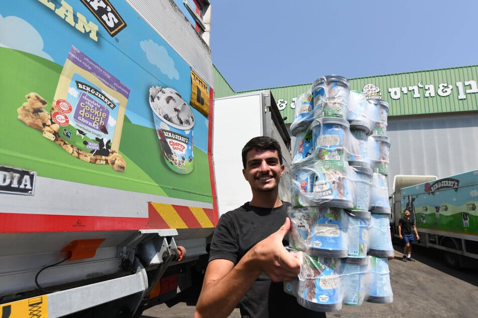 A worker handles tubs of Ben & Jerry's ice cream at a factory in Beer Tuvia in southern Israel.