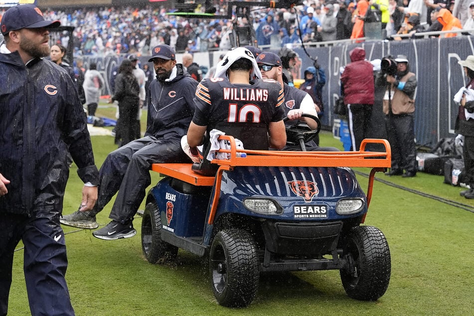 Caleb Williams of the Chicago Bears is carted off the field after an injury against the Minnesota Vikings on September 20, 2026.