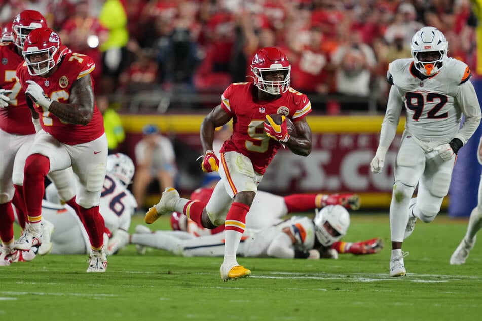 Kansas City Chiefs running back Kenneth Walker III rushes the ball against the Denver Broncos in the first half at GEHA Field at Arrowhead Stadium.