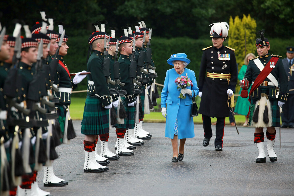 The Queen and Prince William tour Scotland and try a very special drink