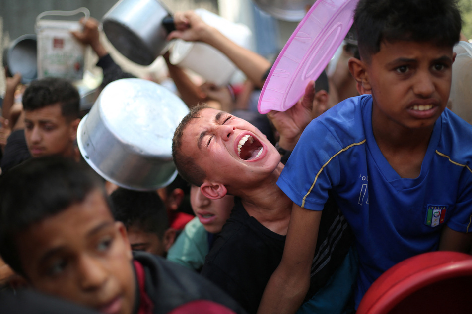 Israel accused of bombing medical charity's Gaza office as aid massacres continue