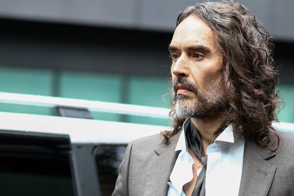 British comedian and actor Russell Brand arrives at the Southwark Crown Court as his rape and sexual assault trial continues in London on Tuesday. Brand took the stand on Wednesday to deliver testimony for the first time.