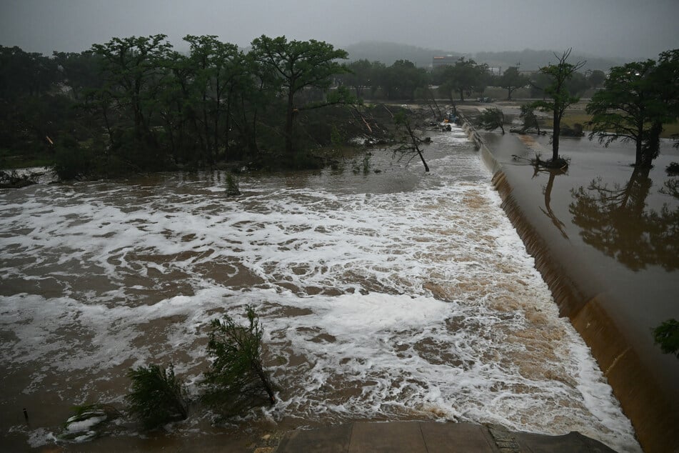 A photo shows flooding caused by a flash flood at the Guadalupe River in Kerrville, Texas, on Saturday.