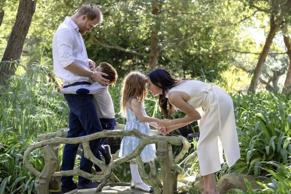 (From l. to r.) Prince Harry, son Archie, daughter Lilibet, and wife Meghan Markle are heading to the UK in July.
