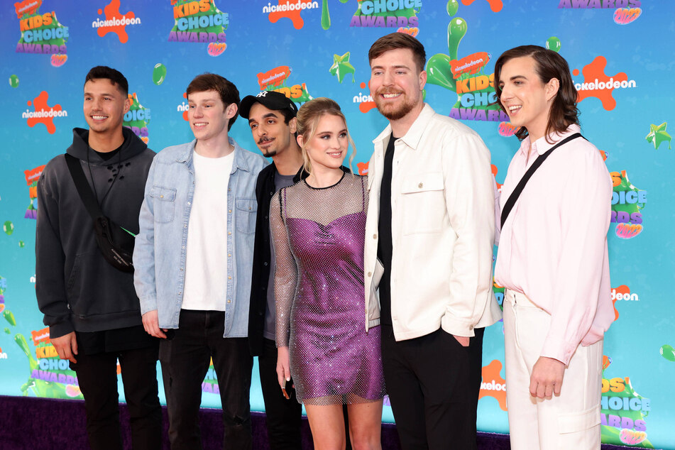 Chris Tyson (far right) has worked with MrBeast since the beginning, but some fans refuse to accept their gender transition.